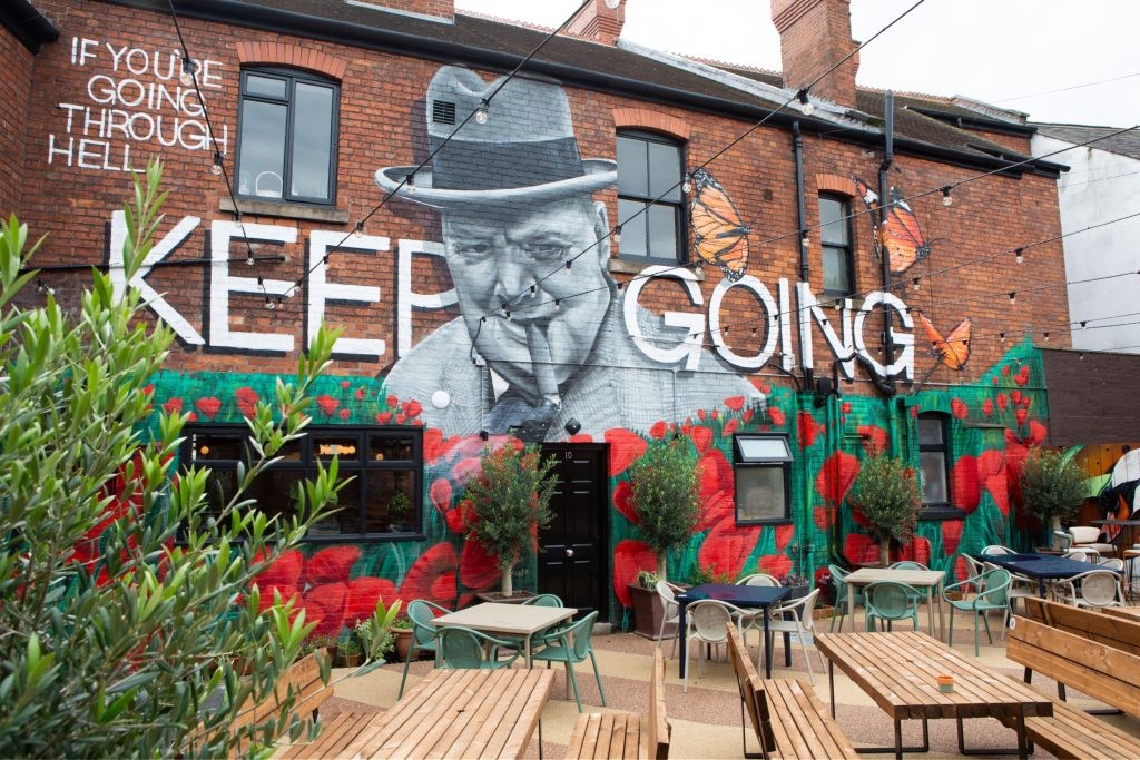 External area with painting of Winston Churchill at Swan & Chequers