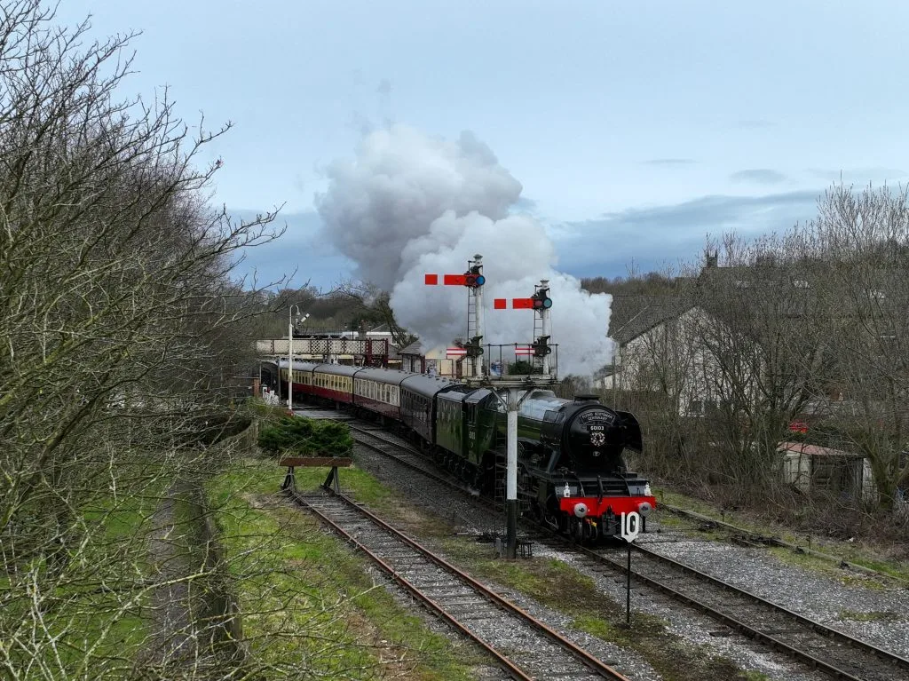 The Flying Scotsman passing through Ramsbottom level crossing