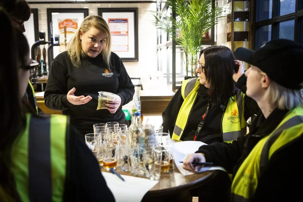 Project Brewer Natalie Reddy, discussing hop aromas and profiles with Customer Services team